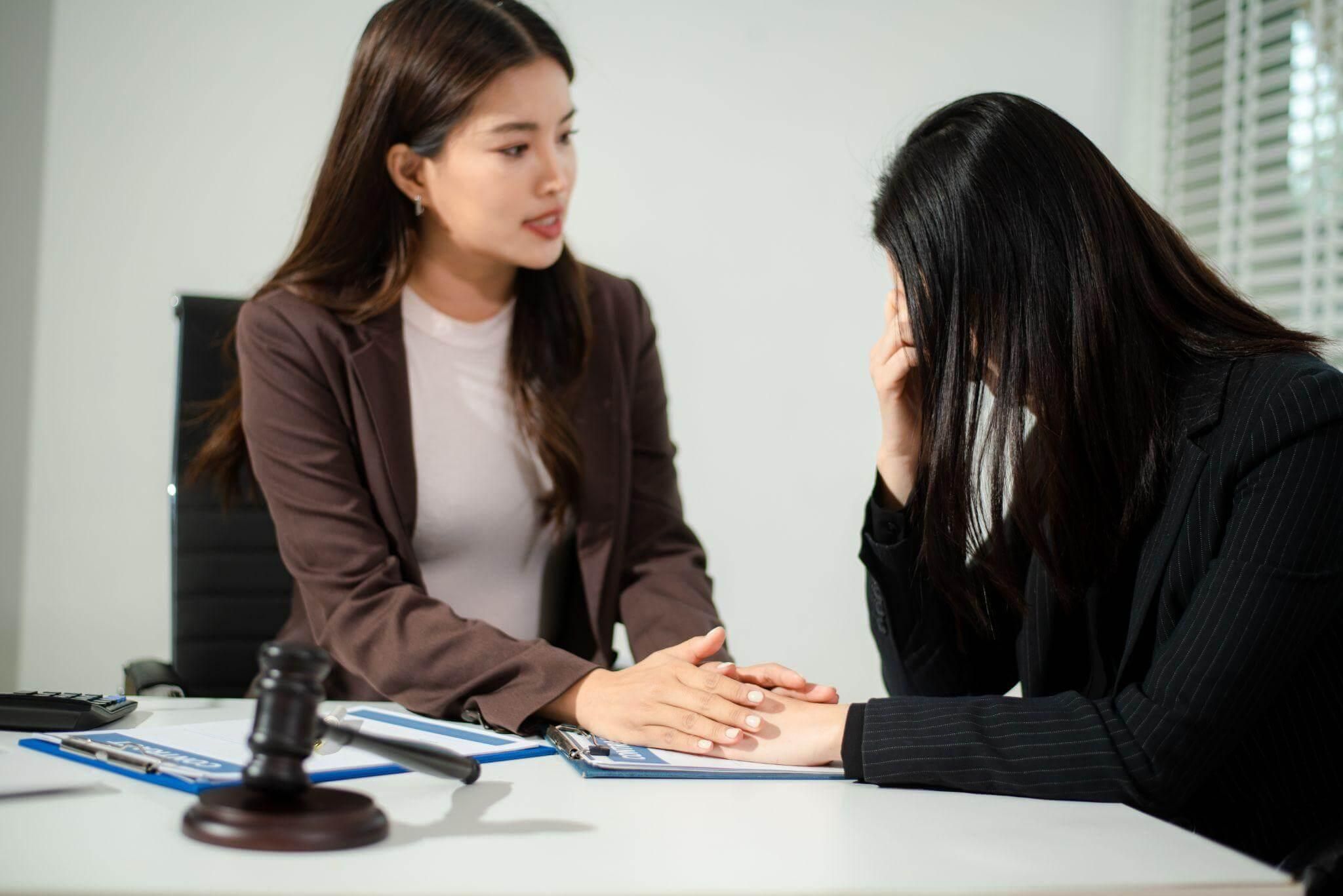 Wrongful Death Attorney Consoling Client
