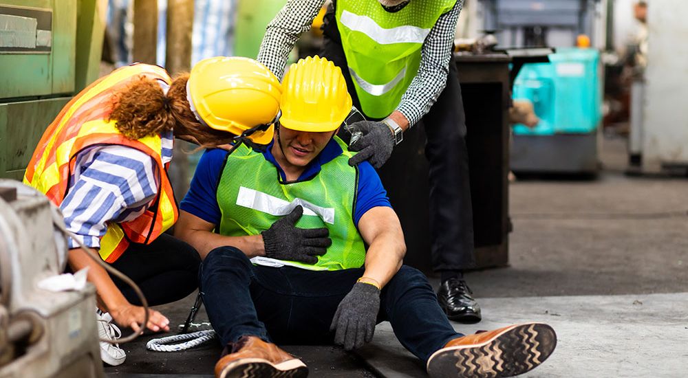 A man on a construction site falls down in the workplace in Greenville South Carolina and needs help from his staff members. He will bring up the case later with a personal injury attorney