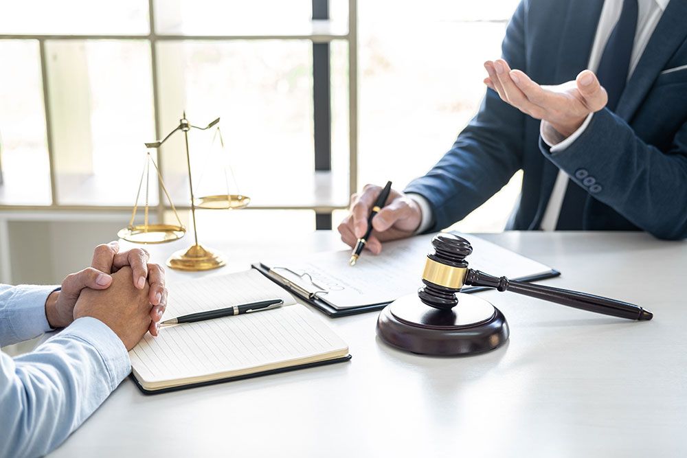 Man talking with an estate planning lawyer