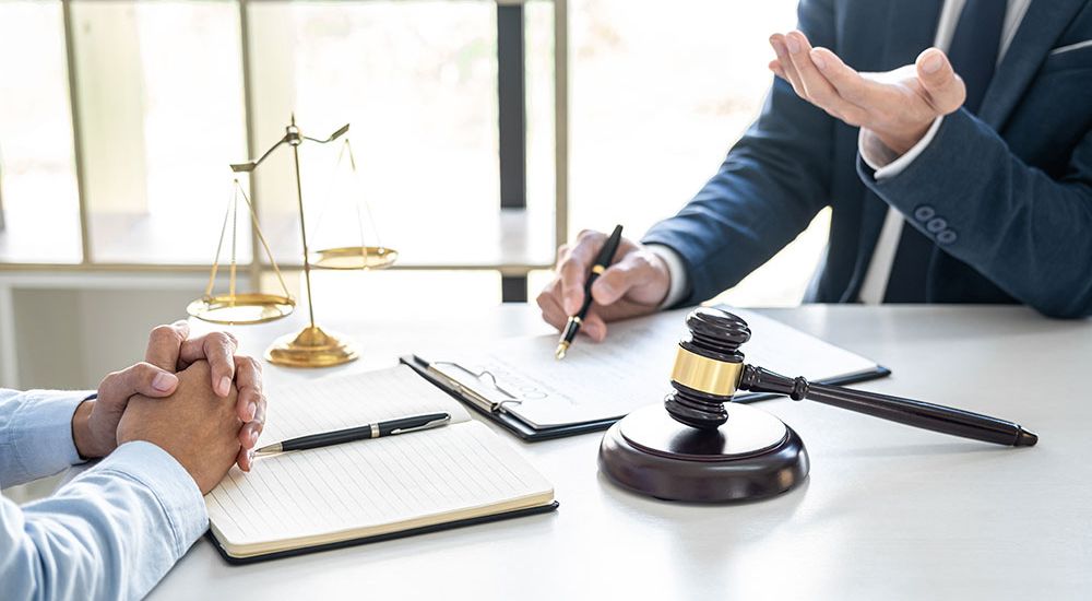 Man talking with an estate planning lawyer
