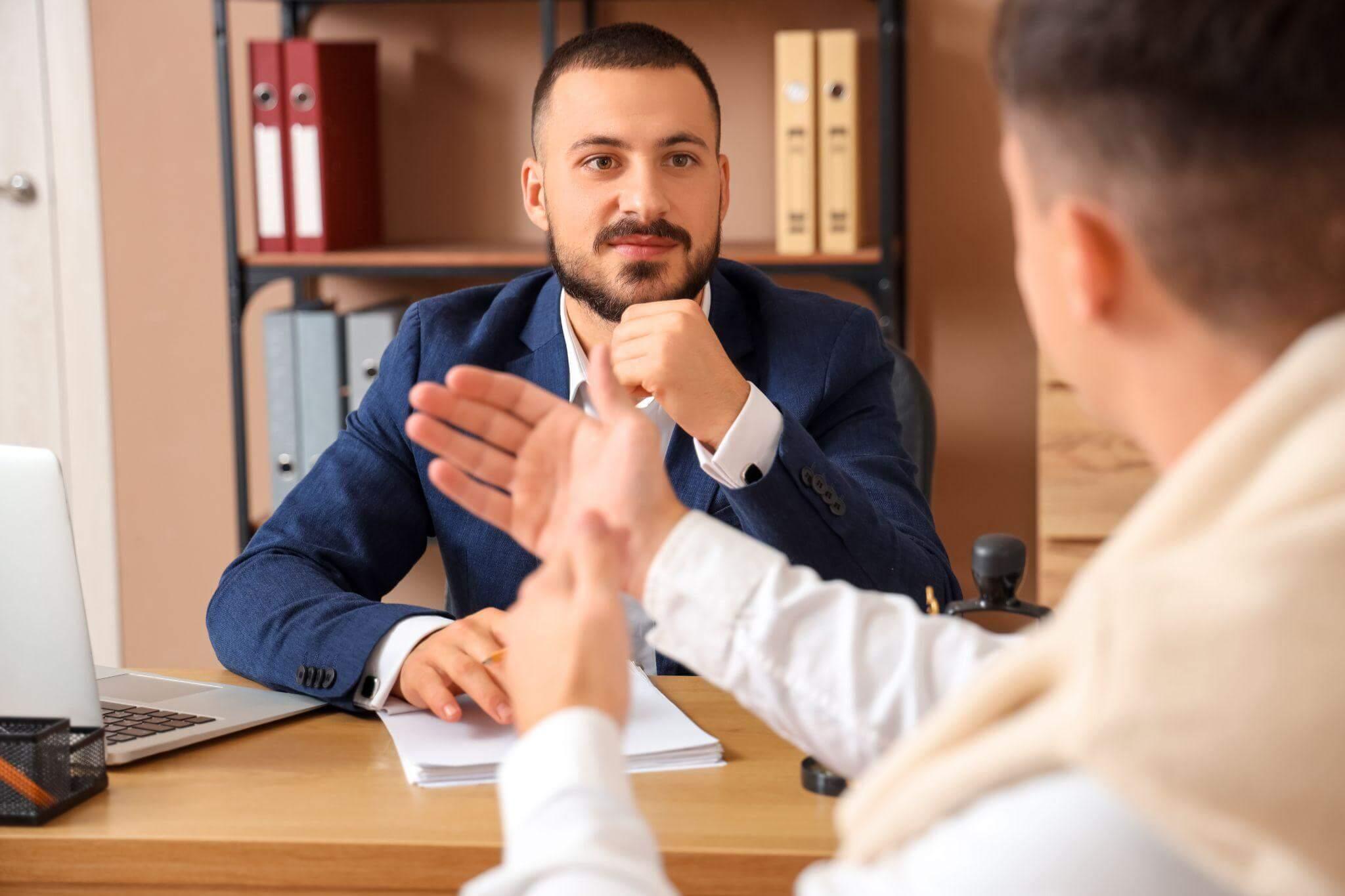 Two men discussing legal compensation for an airbag concussion